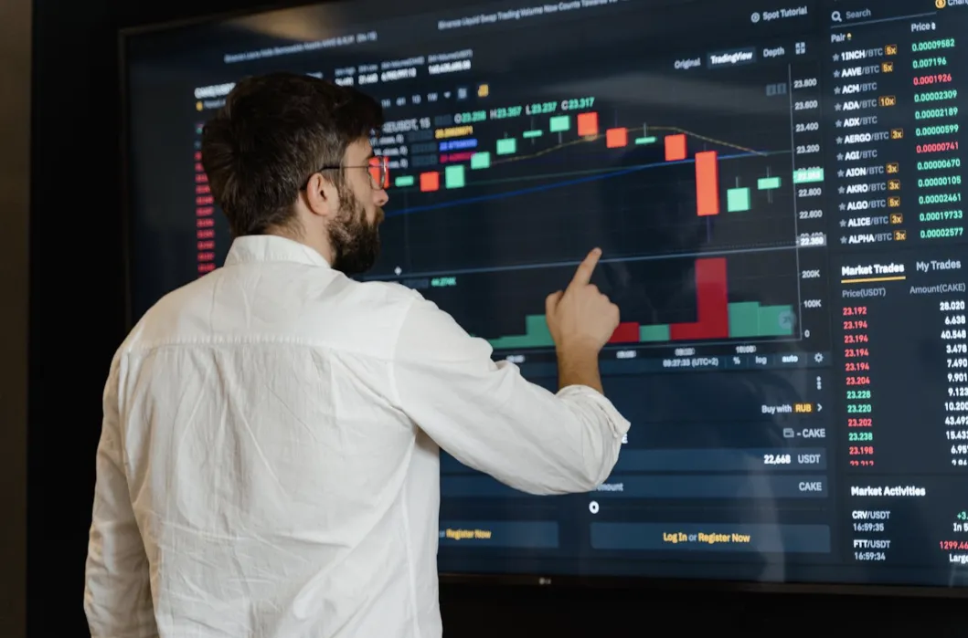 person interacting with stock chart